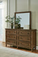 Sturlayne King Upholstered Panel Bed with Mirrored Dresser and Chest